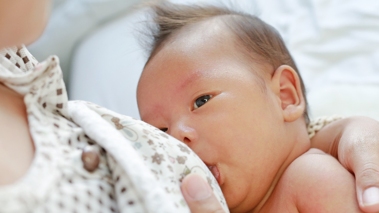 Baby being breastfed